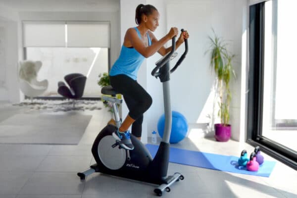 JTX Cyclo-Go Home Exercise Bike - with a female model exercising