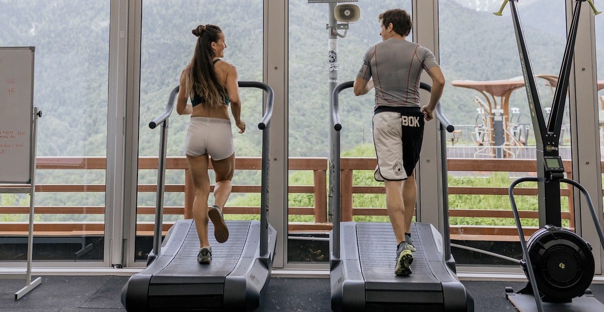 A couple running on a treadmill