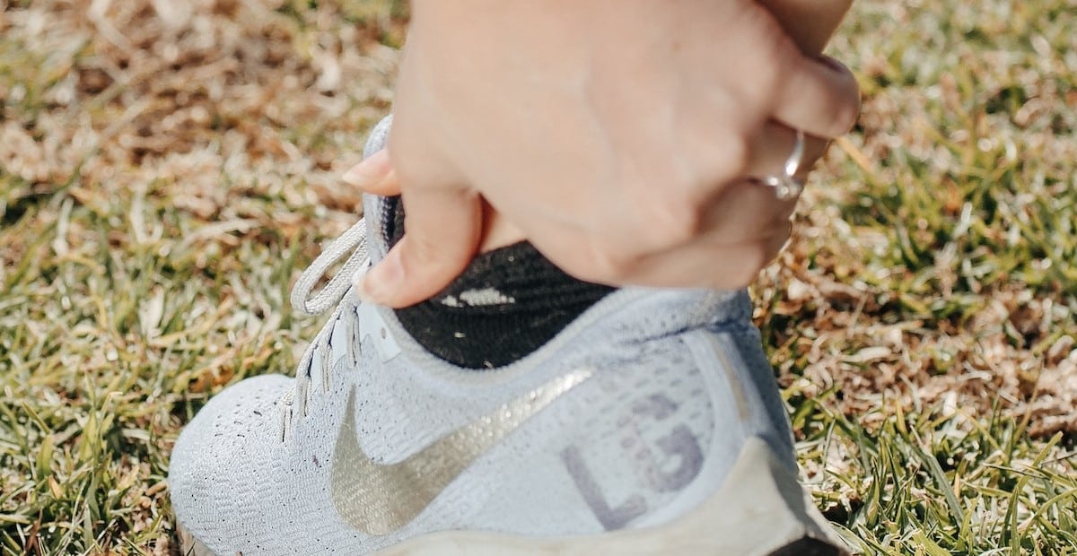 A Person Holding his Ankle