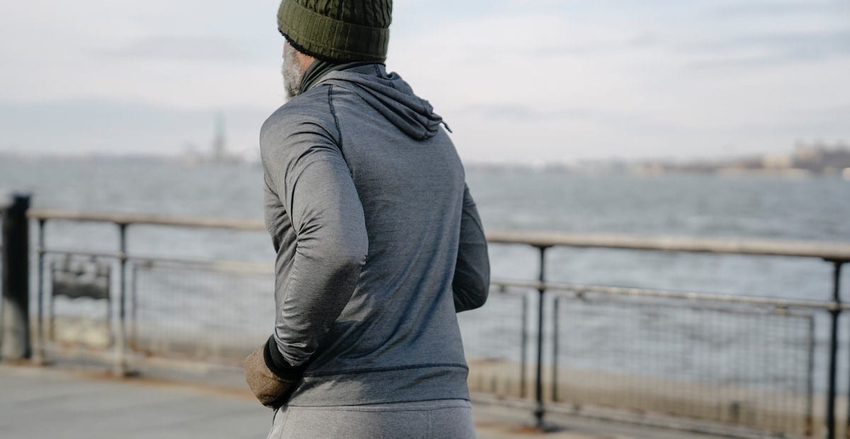 An aged man running on embankment