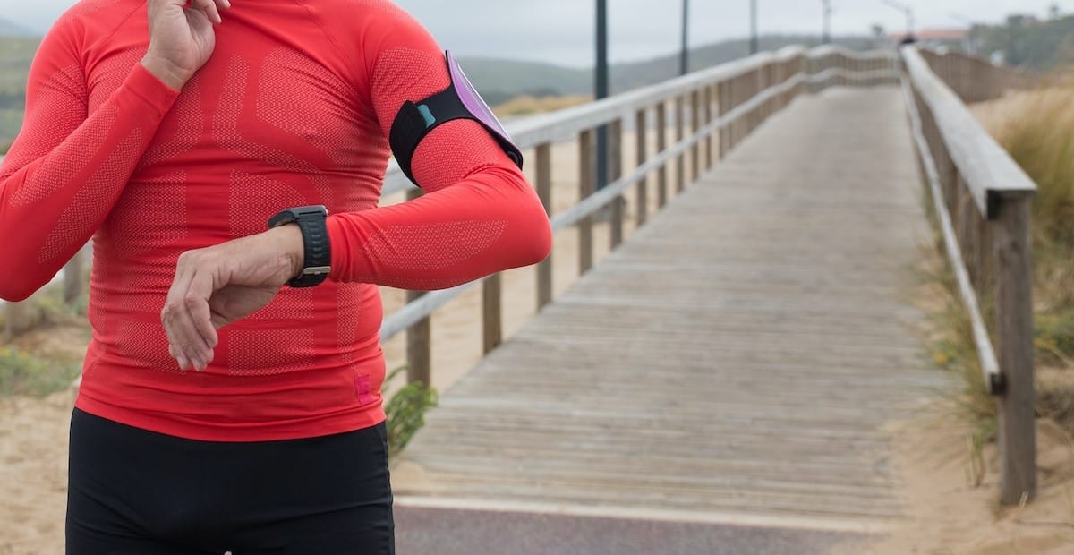 A man wearing red top, jogging