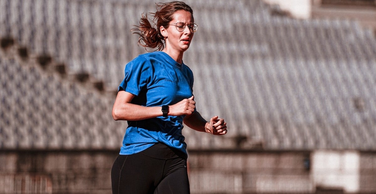 Woman Running on a Running Track